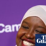 Sagal Abdi-Wali smiles in a pink hijab and blazer after her by-election win